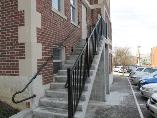 steel railing installation along side of stairway outdoors