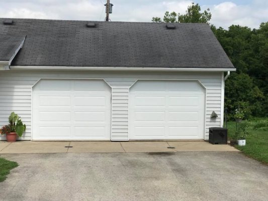 dual bay garage doors installed in a detached garage